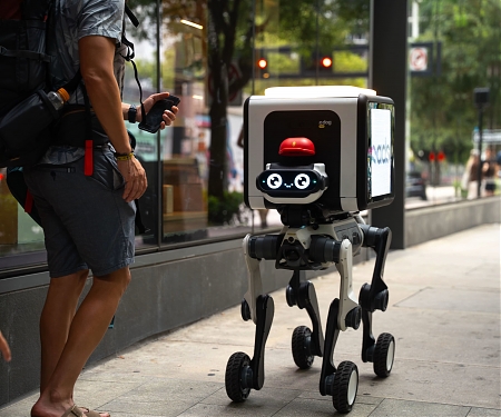 (Video) Wheel-Legged Robot Dog Dumps Packages – And Ads