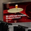 Stella Artois Shows Actual Flight Delays On Billboards, Reframing Them As Unplanned Breaks